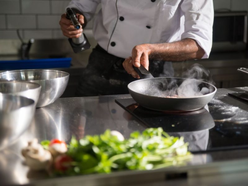 Chef working the grill in the open kitchen